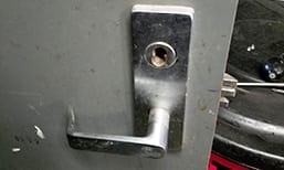 Unlocking a commercial door lock with tools