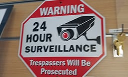 image of a 24 hour surveillance logo