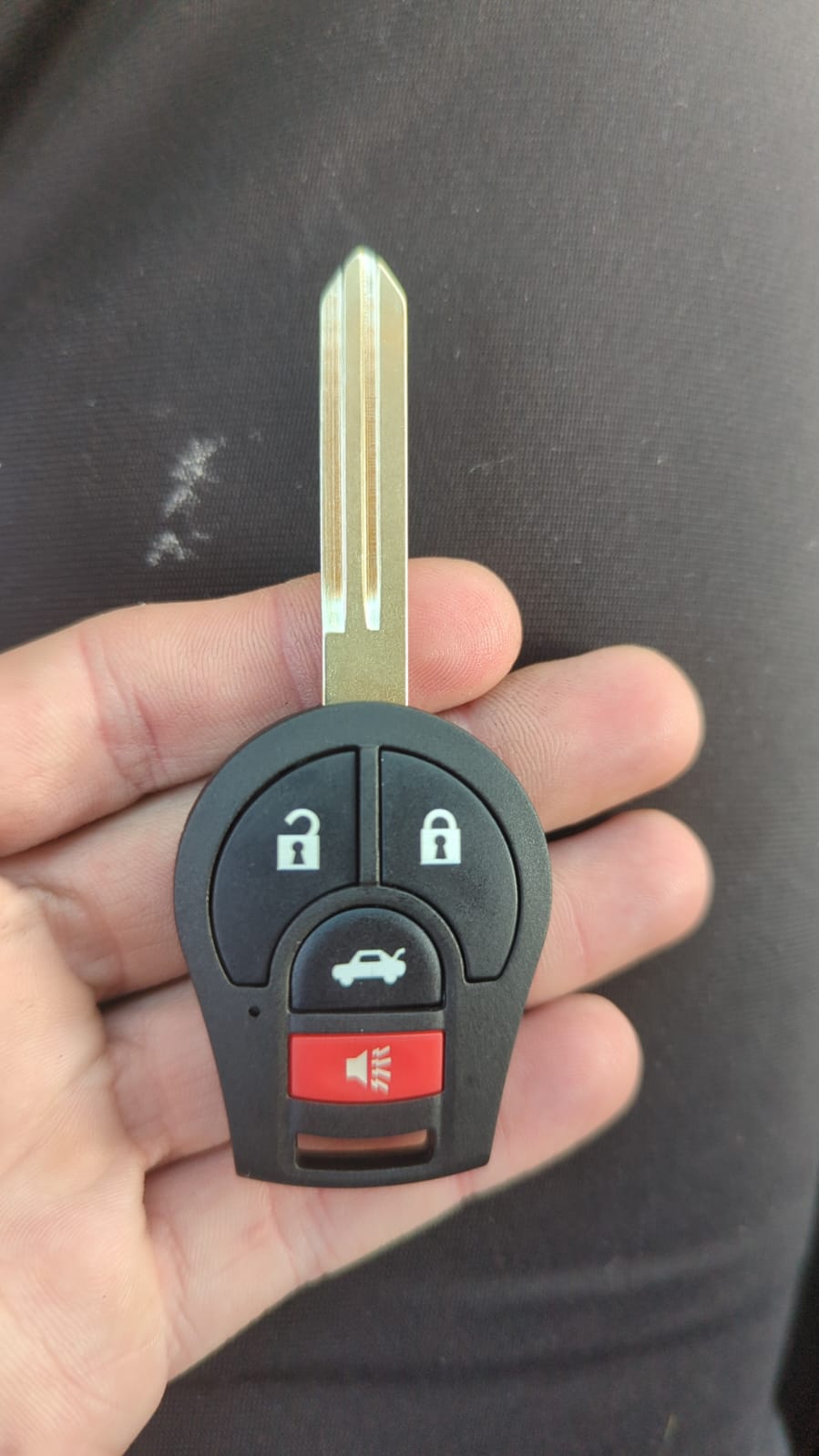Nissan Key in locksmith hand
